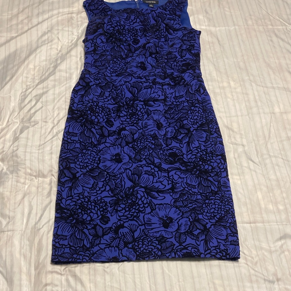 Size 4 dark blue sleeveless dress with fitted waist and side pockets